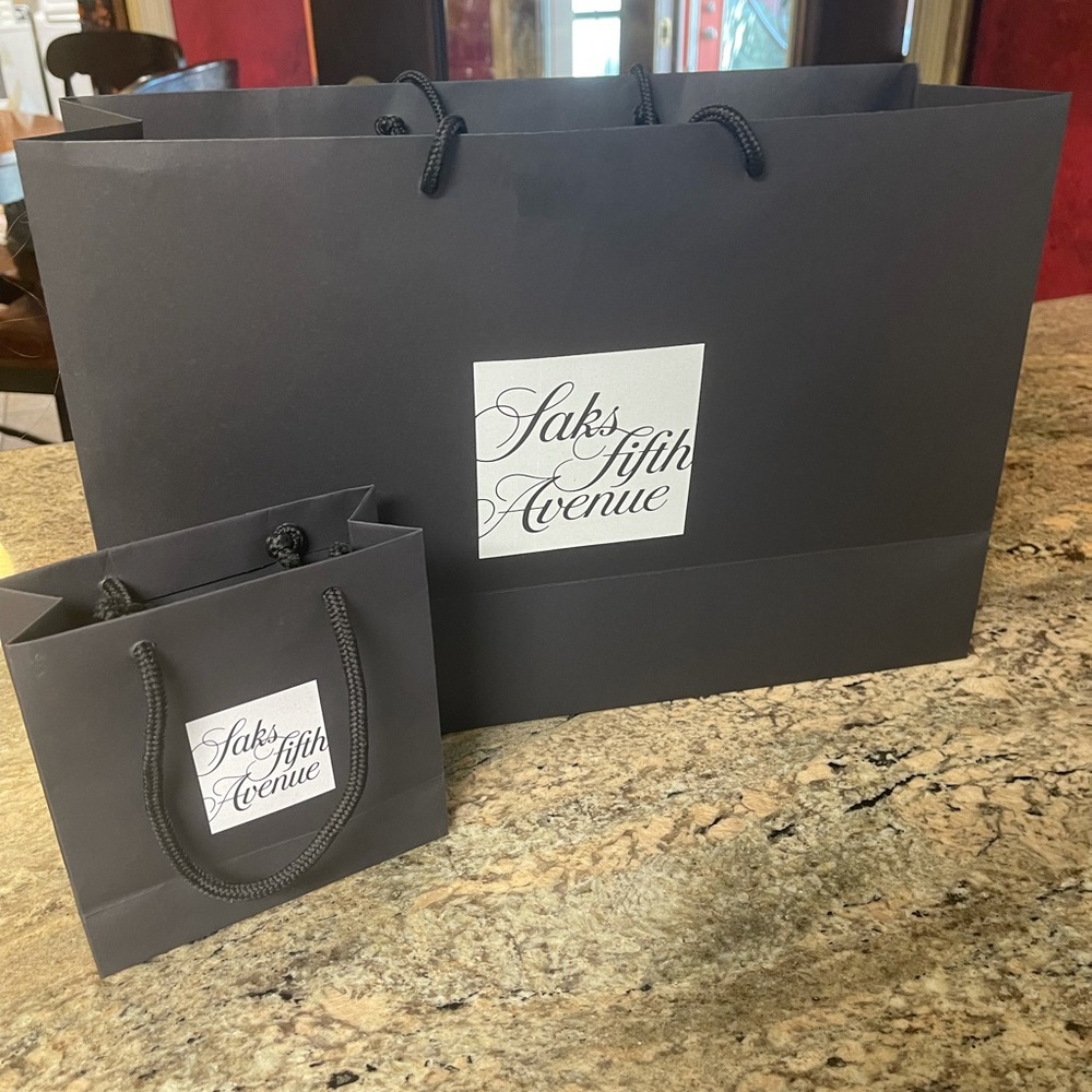 One medium size and one small Saks Fifth Avenue bag sold together.